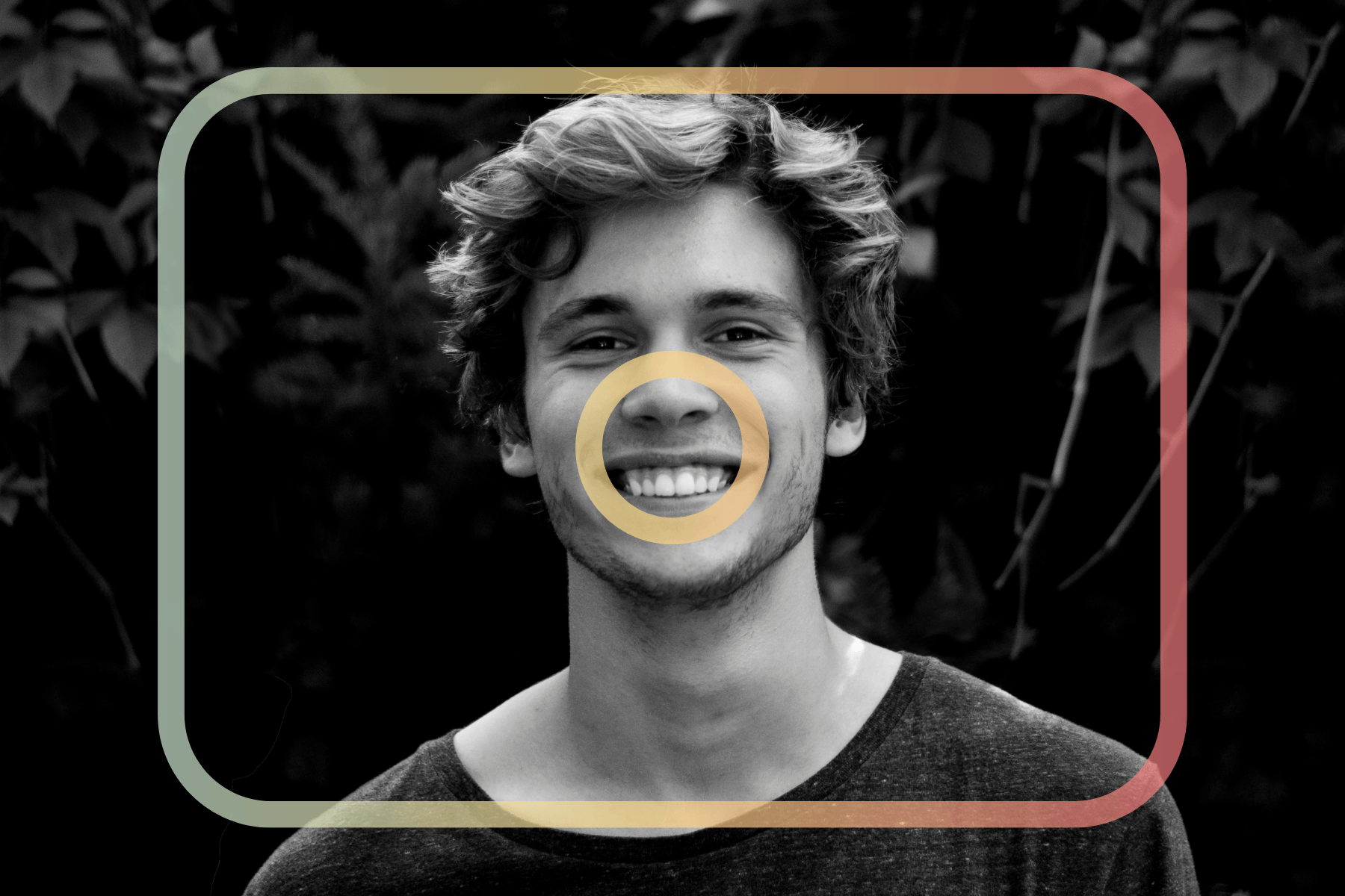 Black and white portrait of a young man smiling, framed by colorful geometric shapes.