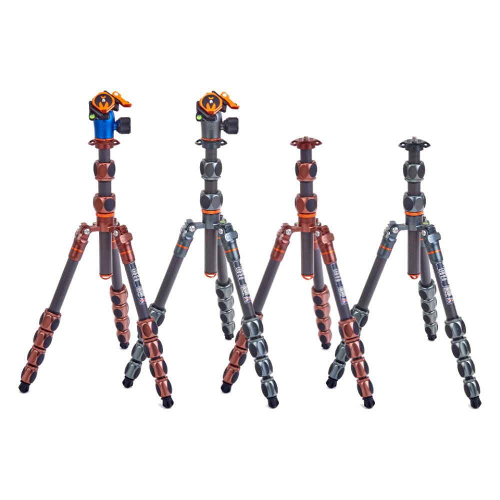 Gray and orange tripods with adjustable legs and quick release plates.