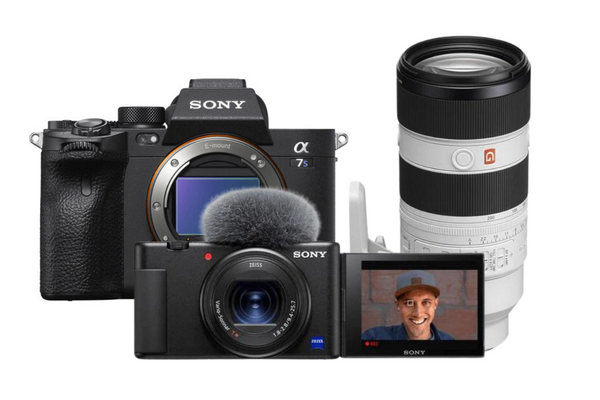 Black camera with a lens, microphone, and a white lens with a red stripe.