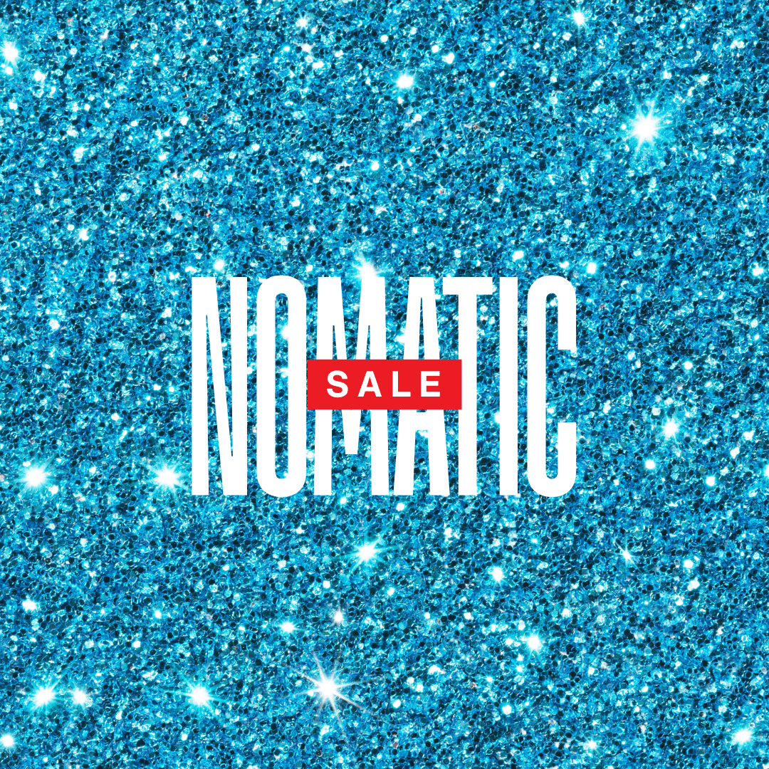 Sparkly blue background with white text 'NOMATIC' and red text 'SALE'.