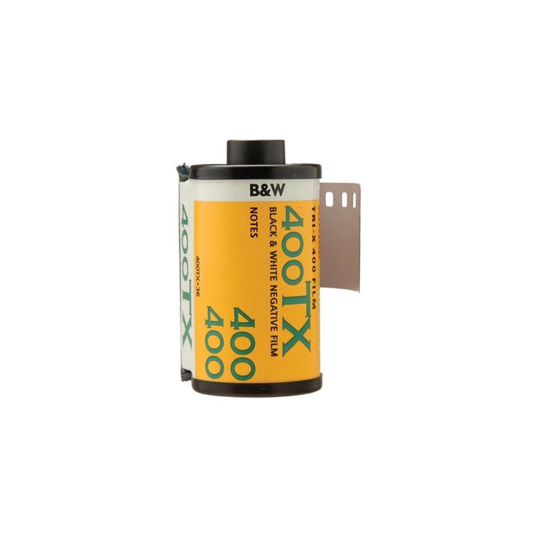Yellow and black 35mm film canister with a portion of the film showing at the top.