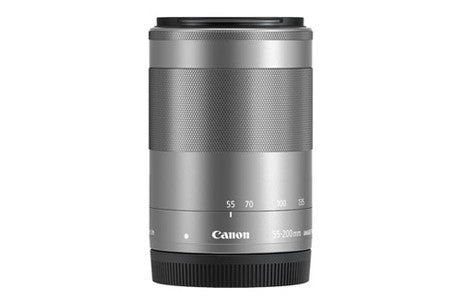 Silver Canon mirrorless lens with focal lengths 55-200mm and textured grip.