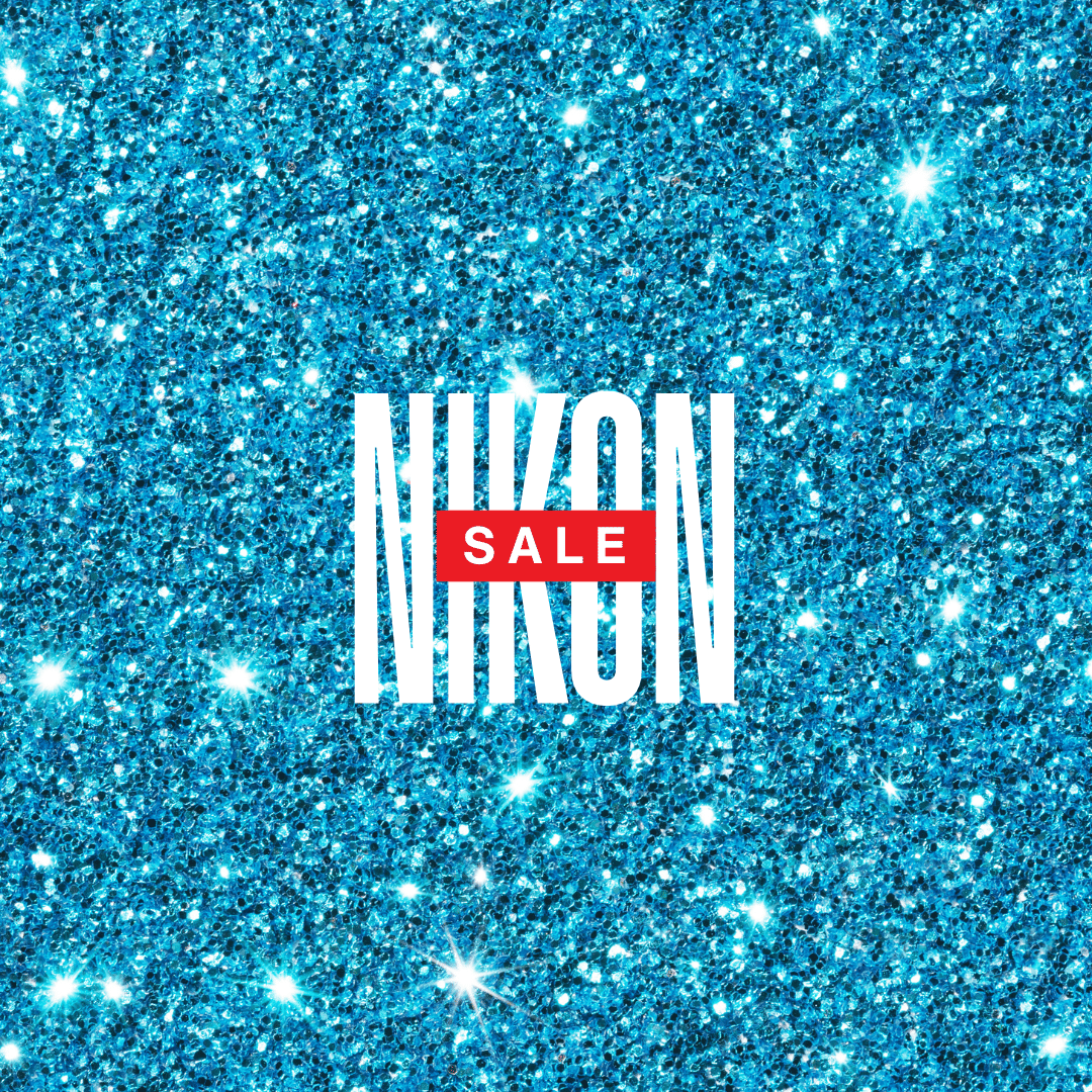 Sparkling blue background with bold white text reading Nikon and SALE in red.