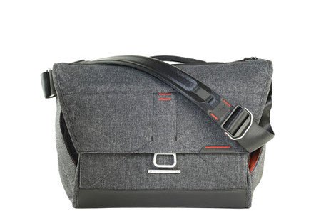 Gray shoulder bag with adjustable black strap and red accents.