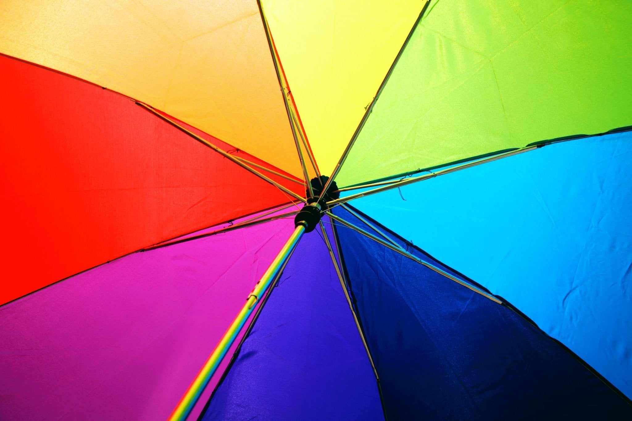 Colorful umbrella showcasing various shades, symbolizing the concept of Kelvin color temperature in photography.